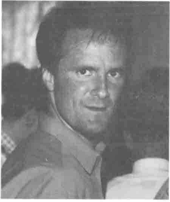 Head and shoulders of a smiling man
