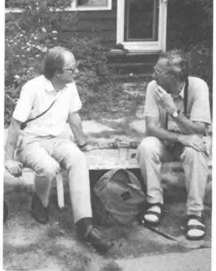 Adrian Smith and Dieter Lattermann talking on a bench