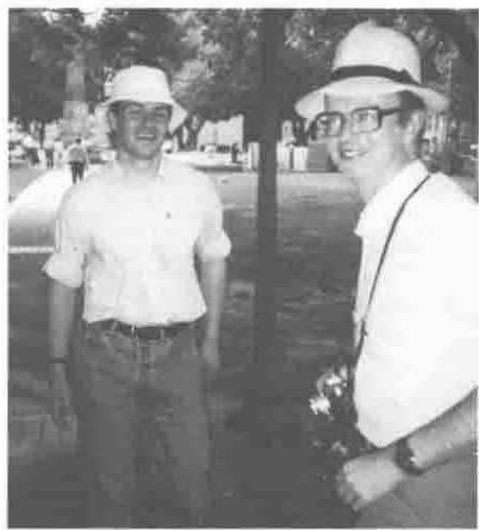 Two men in sun hats in a park