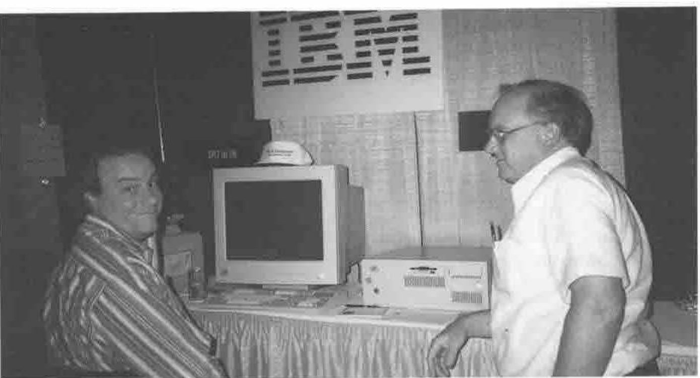Two men at a computer on the IBM stand