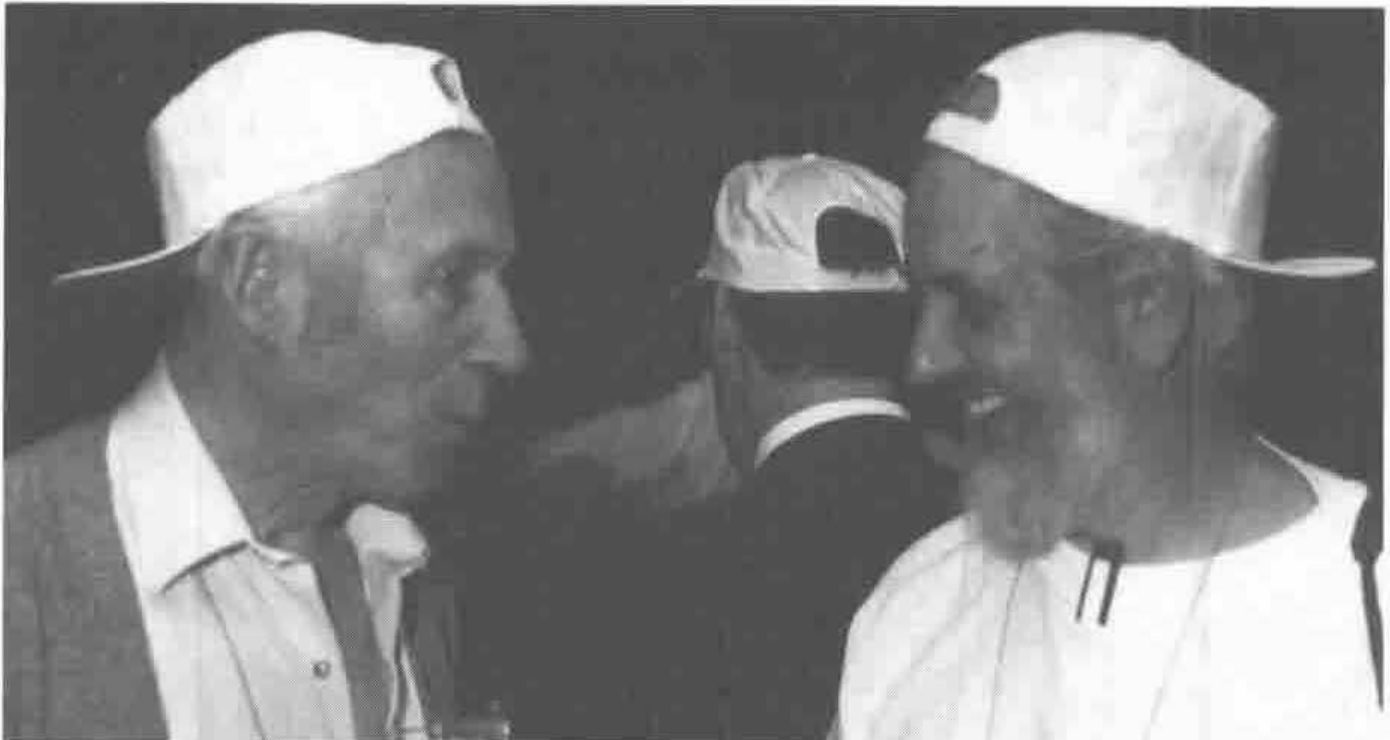 Donald McIntyre and Anthony Camacho in white caps worn backwards