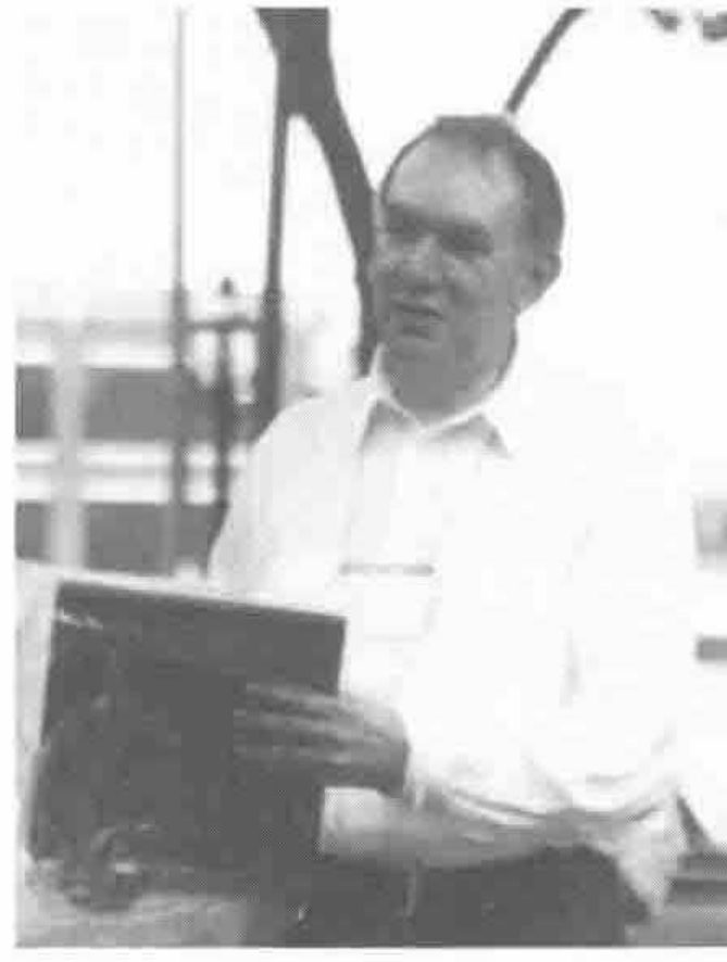John Scholes holding a plaque