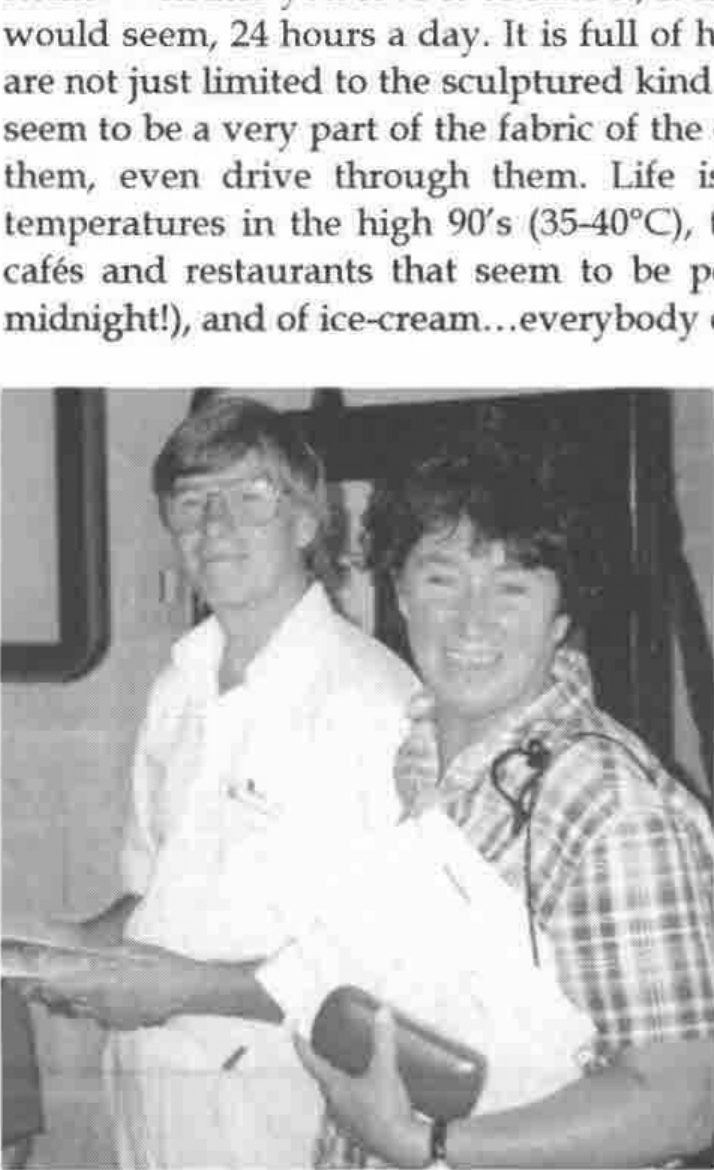 David and Annette Crossley, smiling, he holding papers