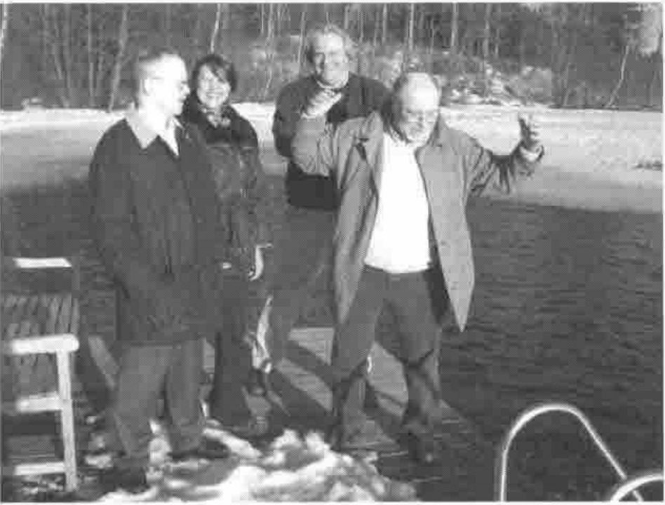 Olli Palosaari, Eija Ahopelto, Kimmo Kekäläinen and David Liebtag on a jetty by the lake