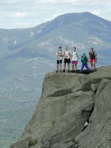 high-res photo of hiking group on rock