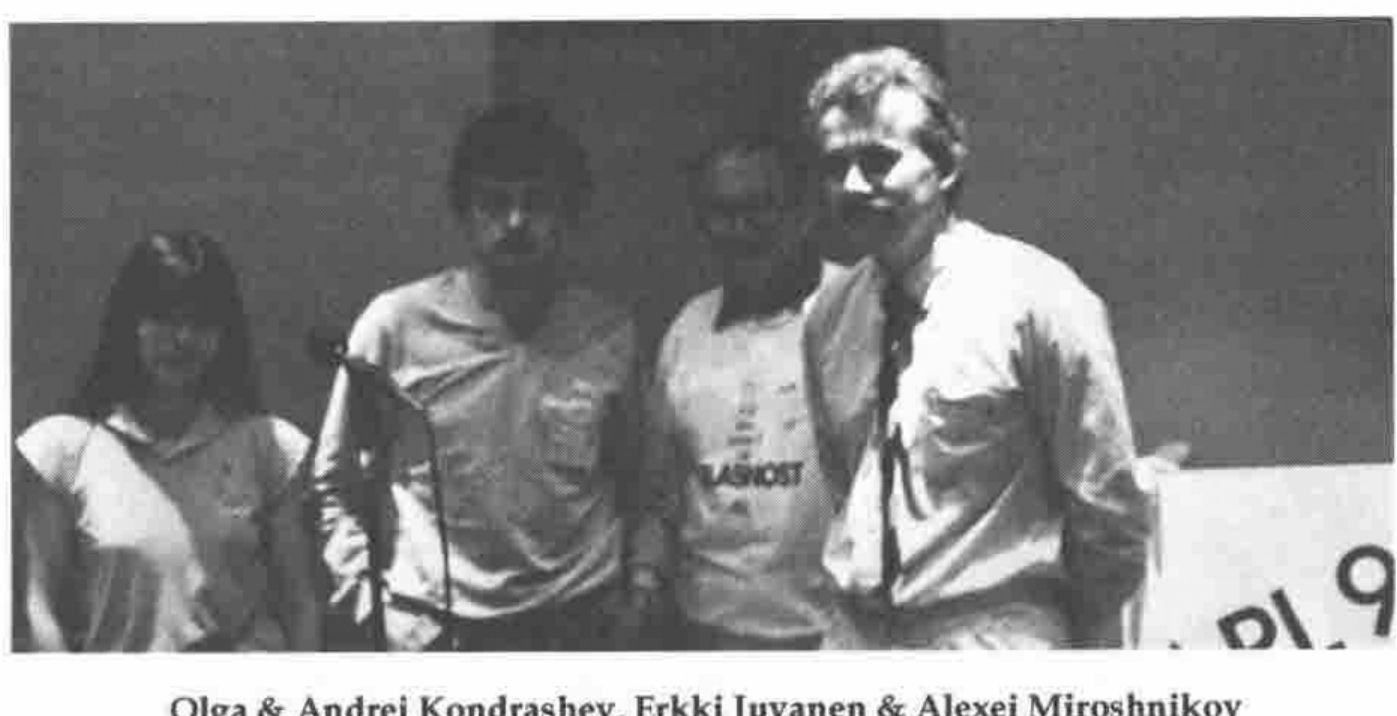 Four people standing in front of an APL90 banner