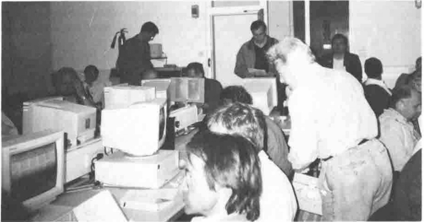 Photograph: attendees working at PCs in a computer lab