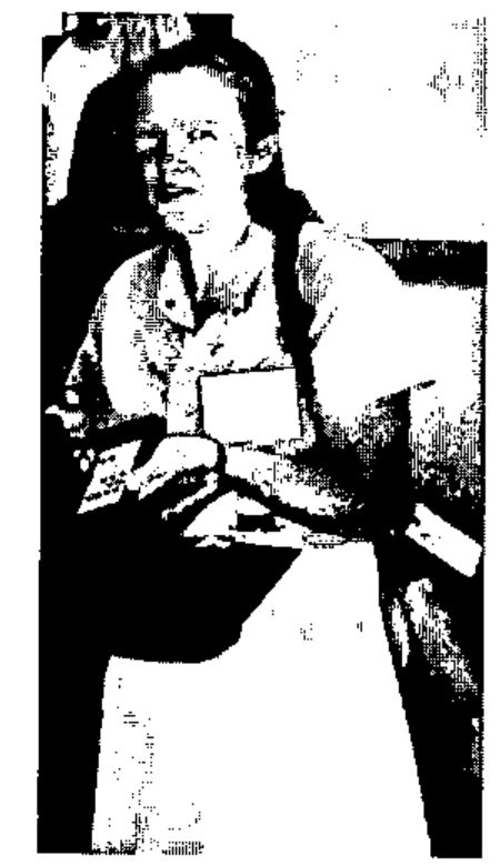 Photograph of Gill Smith, wearing a conference badge