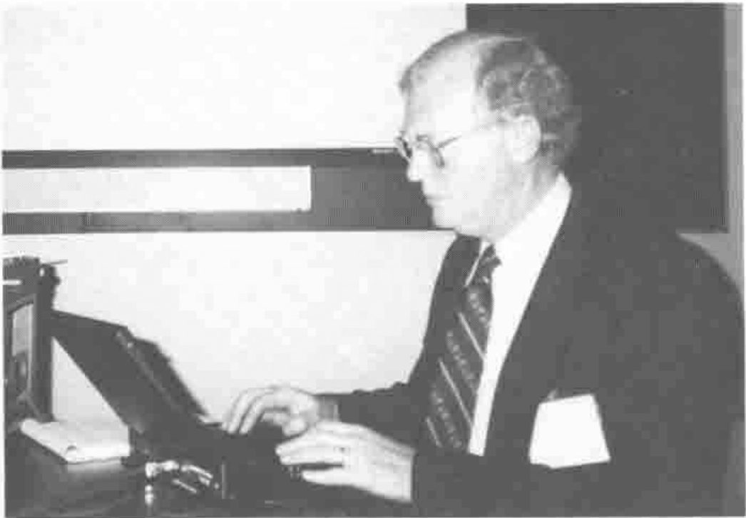 Photograph of Ed Shaw, seated at a keyboard