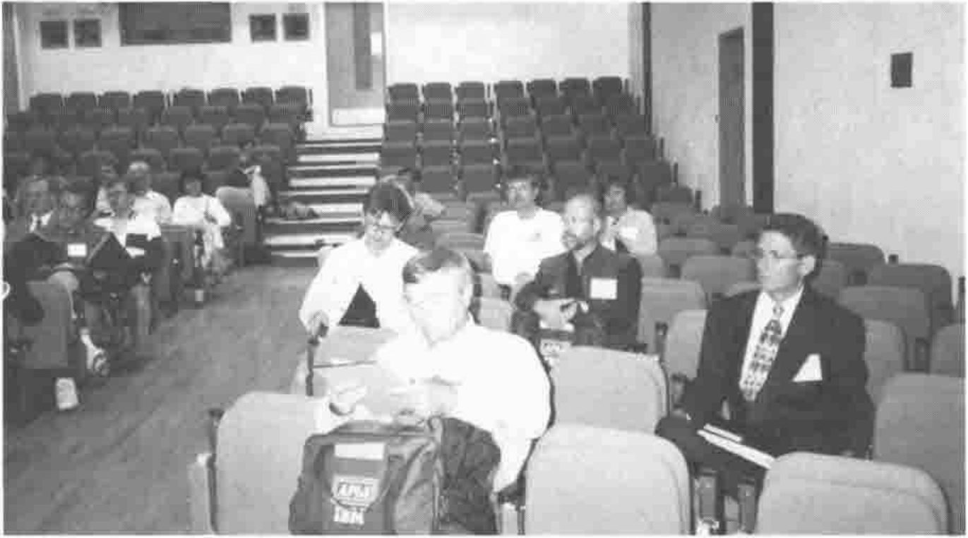 Photograph of delegates seated in the tiered lecture hall