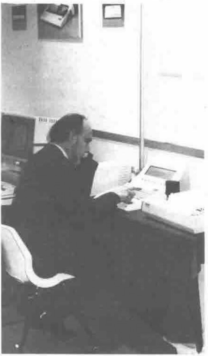 Gerald Langlet, a French delegate, tries out a problem on an Ampere micro.