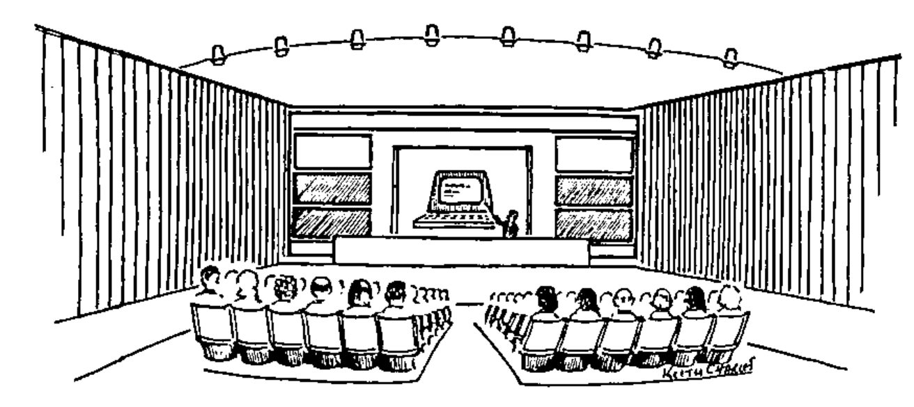 Drawing of a lecture theatre: an audience in two banks of seats faces a stage where a speaker stands beside a large projected computer terminal