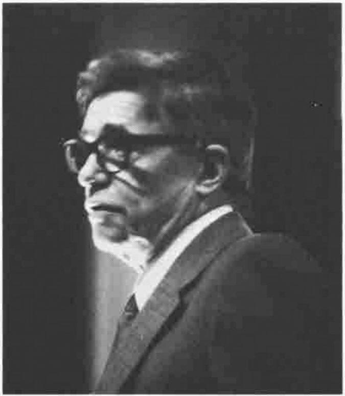 Photograph of Ken Iverson speaking