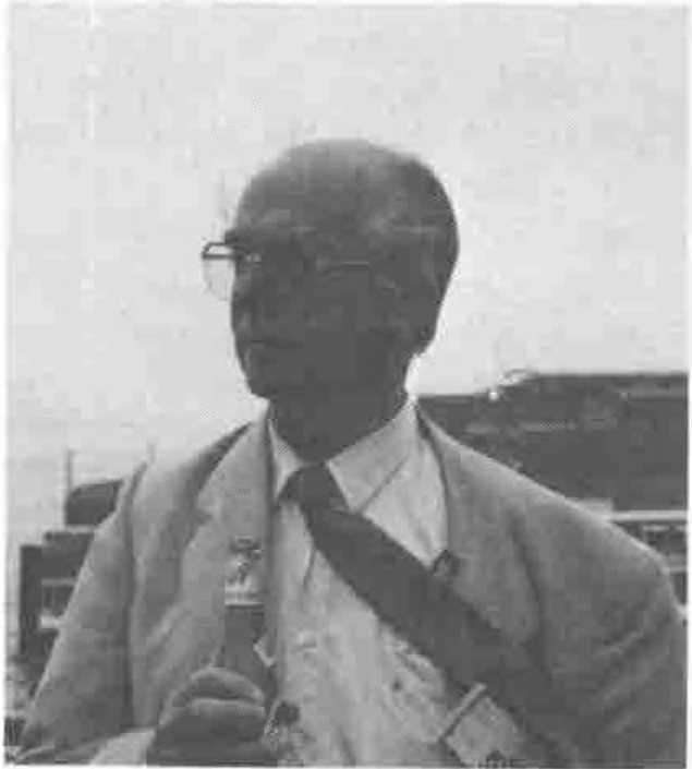 Photograph of Per Gjerlov holding a bottle of beer