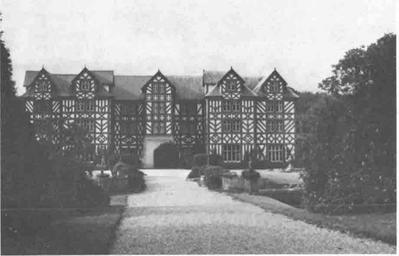 Photograph of Greg-y-Nog Hall, a timber-framed house, seen from the gardens