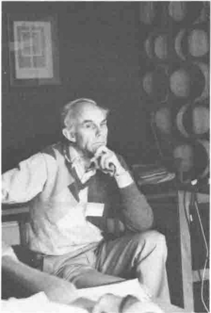 Photograph of Norman Thomson seated, chin on hand