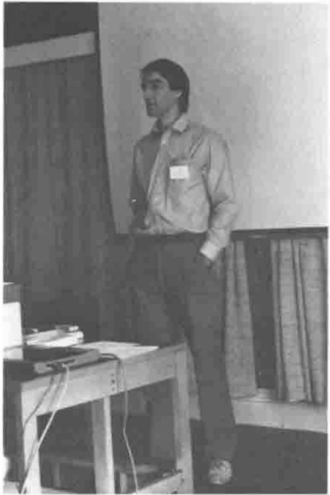 Photograph of Tony O'Hagan standing at the front of the conference room