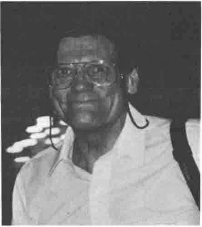 A man in glasses, photographed at night